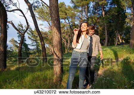 Young couple strolling in coastal forest, Split, Dalmatia, Croatia View Large Photo Image Stock Image - Young couple strolling in coastal forest, Split, Dalmatia, Croatia. Fotosearch