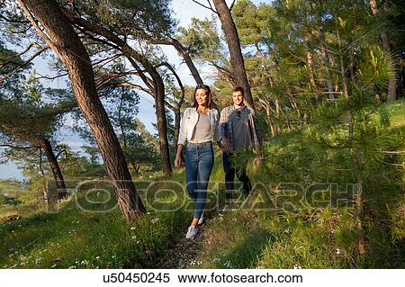Stock Photography - Young couple strolling in coastal forest, Split, Dalmatia, Croatia. Fotosearch