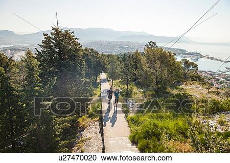 Young man and woman running in park, Split, Dalmatia, Croatia View Large Photo Image Stock Image - Young man and woman running in park, Split, Dalmatia, Croatia. Fotosearch