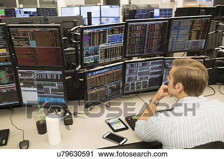 Young trader analyzing computer data View Large Photo Image Stock Image - Young trader analyzing computer data. Fotosearch