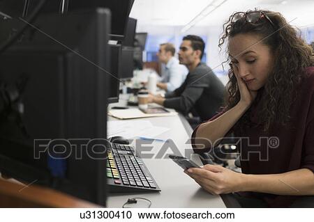 Young trader using mobile phone View Large Photo Image Stock Image - Young trader using mobile phone. Fotosearch