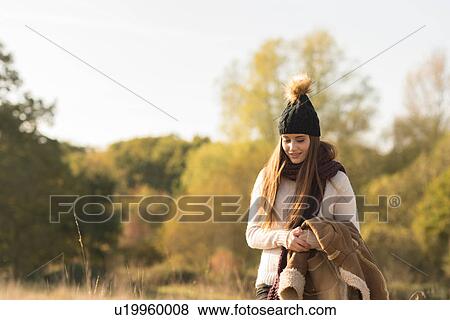 Young woman walking in rural setting View Large Photo Image Stock Photo - Young woman walking in rural setting. Fotosearch
