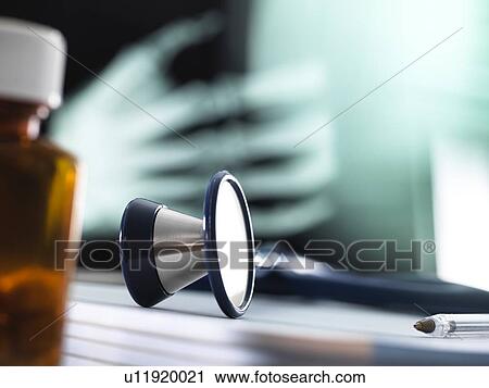 Stock Image - Close-up of a stethoscope on a doctor's desk.. Fotosearch
