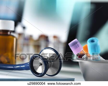 Close-up of blood samples and a stethoscope on a doctor's desk. View Large Photo Image Picture - Close-up of blood samples and a stethoscope on a doctor's desk.. Fotosearch