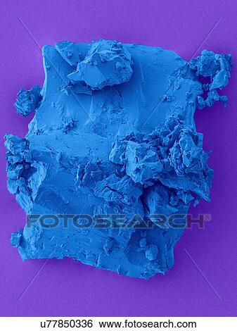 Stock Photograph - Coloured scanning electron micrograph (SEM) of Coal from the ship Titanic. Coal is a fossil fuel (combustible sedimentary rock) that forms when dead plant matter is converted into peat. Over time geological processes convert peat into lignite, then.... Fotosearch