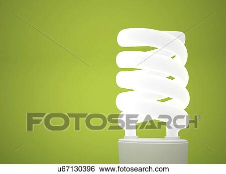 Stock Photograph - Energy saving lightbulb against a green background.. Fotosearch