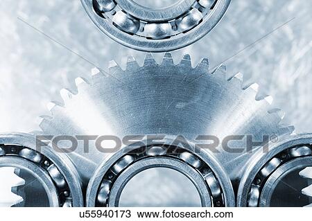 Stock Image - Large gears with ball bearings.. Fotosearch