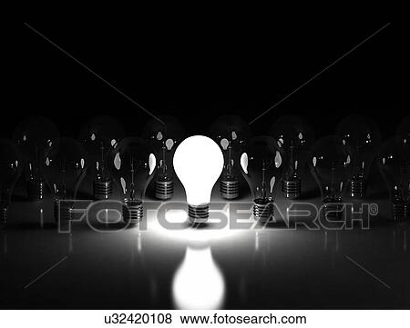 Stock Photo - Lightbulbs against a black background.. Fotosearch