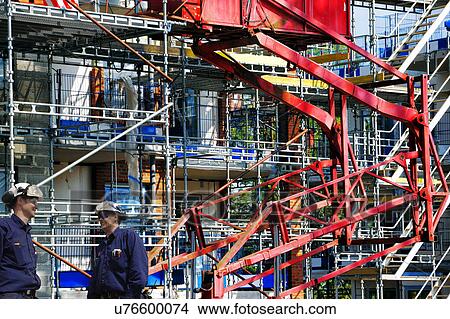 MODEL RELEASED. Construction workers on a site with scaffolding. View Large Photo Image Picture - MODEL RELEASED. Construction workers on a site with scaffolding.. Fotosearch