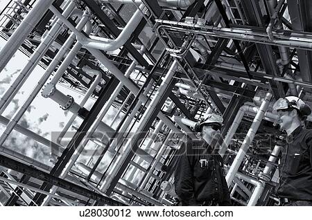 MODEL RELEASED. Oil pipelines with industrial workers. View Large Photo Image Stock Image - MODEL RELEASED. Oil pipelines with industrial workers.. Fotosearch