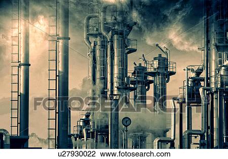 Stock Image - Oil refinery with smoke and chimneys.. Fotosearch