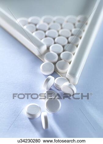 Pills pouring out of measuring triangle. View Large Photo Image Stock Image - Pills pouring out of measuring triangle.. Fotosearch