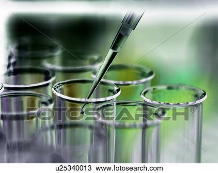 Stock Image - Sample being pipetted into a test tube.. Fotosearch