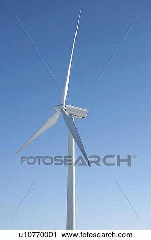 Wind turbine against blue sky. View Large Photo Image Stock Image - Wind turbine against blue sky.. Fotosearch