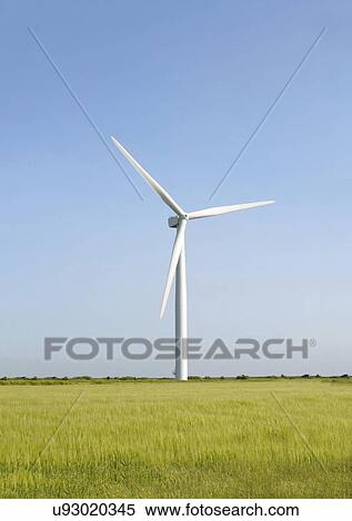 Wind turbine against blue sky. View Large Photo Image Stock Photography - Wind turbine against blue sky.. Fotosearch