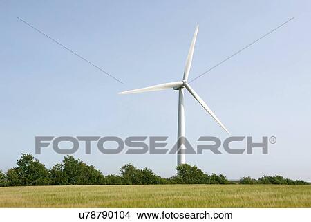 Wind turbine in field. View Large Photo Image Picture - Wind turbine in field.. Fotosearch