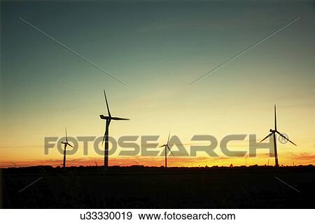 Wind turbines at sunset. Esbjerg, Denmark. View Large Photo Image Stock Photo - Wind turbines at sunset. Esbjerg, Denmark.. Fotosearch
