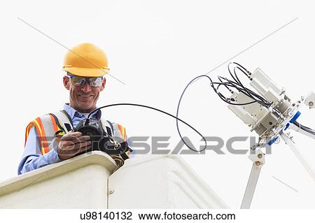 Stock Image - Communications engineer at work. Fotosearch