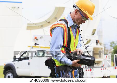 Stock Photo - Communications engineer at work. Fotosearch