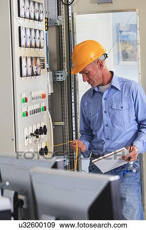 Electrical engineer at work View Large Photo Image Stock Photo - Electrical engineer at work. Fotosearch