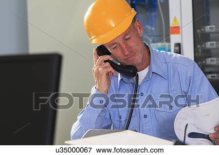 Stock Photo - Electrical engineer at work. Fotosearch