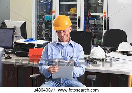 Stock Photo - Electrical engineer at work. Fotosearch