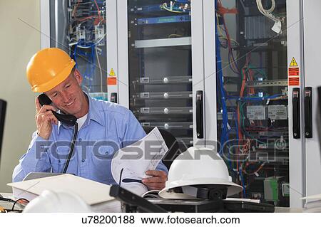 Stock Photo - Electrical engineer at work. Fotosearch