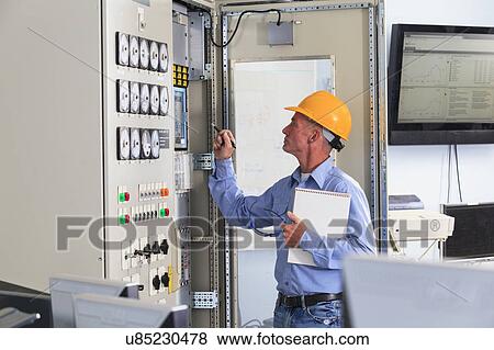 Stock Photo - Electrical engineer at work. Fotosearch
