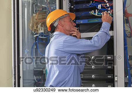 Stock Photo - Electrical engineer at work. Fotosearch