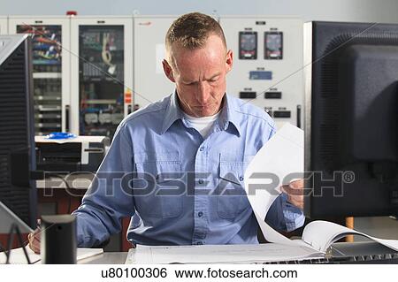 Stock Photograph - Electrical engineer at work. Fotosearch
