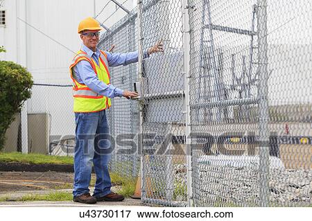 Electrical engineer using security system View Large Photo Image Stock Photo - Electrical engineer using security system. Fotosearch
