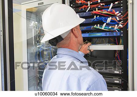 Picture - Engineer working in power plant. Fotosearch