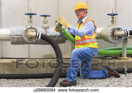 Engineer working in power plant View Large Photo Image Picture - Engineer working in power plant. Fotosearch
