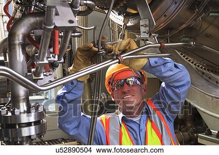 Picture - Engineer working in power plant. Fotosearch