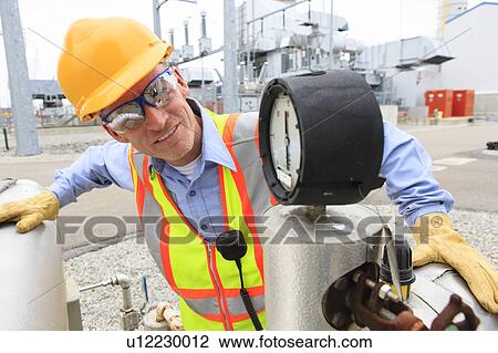 Engineer working in power plant View Large Photo Image Stock Image - Engineer working in power plant. Fotosearch