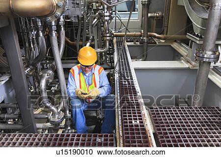 Engineer working in power plant View Large Photo Image Stock Image - Engineer working in power plant. Fotosearch