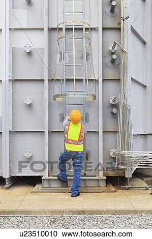 Stock Image - Engineer working in power plant. Fotosearch