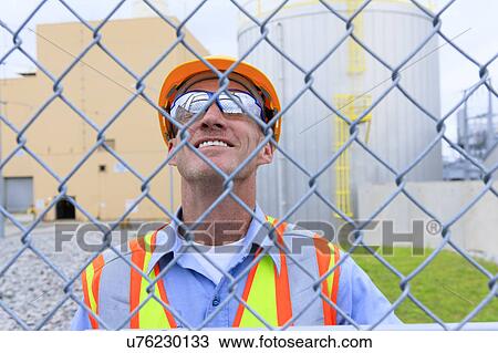 Stock Image - Engineer working in power plant. Fotosearch
