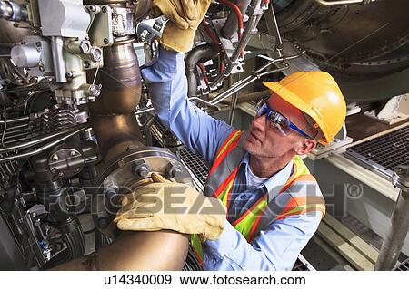 Stock Photo - Engineer working in power plant. Fotosearch