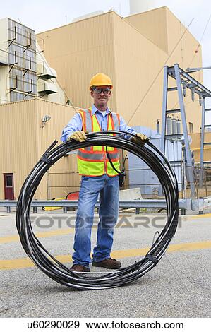 Stock Photo - Engineer working in power plant. Fotosearch