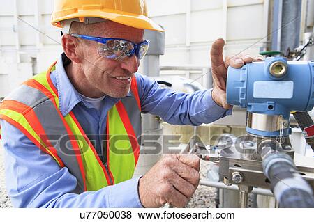 Stock Photo - Engineer working in power plant. Fotosearch