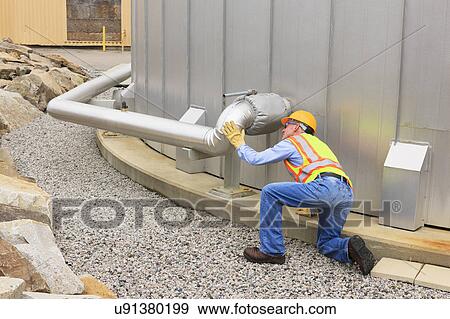 Stock Photo - Engineer working in power plant. Fotosearch