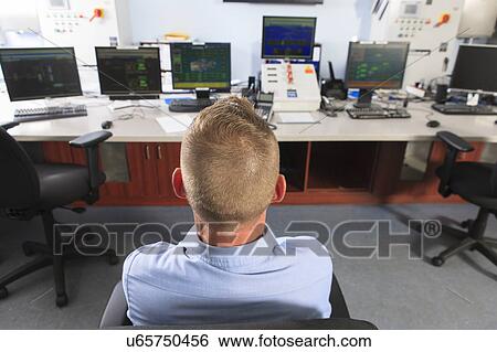 Stock Photograph - Engineer working in power plant. Fotosearch