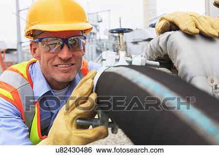 Engineer working in power plant View Large Photo Image Stock Photograph - Engineer working in power plant. Fotosearch