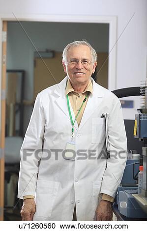Stock Image - Engineering professor in chemistry laboratory. Fotosearch