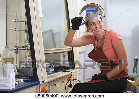 Stock Image - Engineering student in a chemistry laboratory. Fotosearch