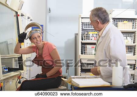 Stock Image - Engineering student in a chemistry laboratory. Fotosearch