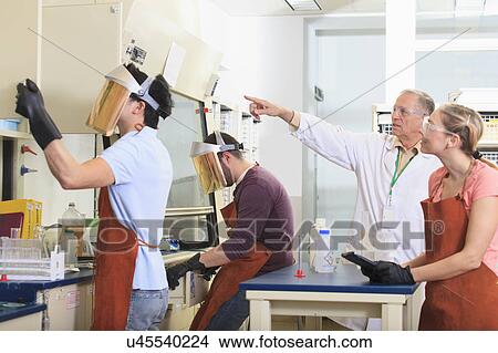 Picture - Engineering students in a chemistry laboratory. Fotosearch