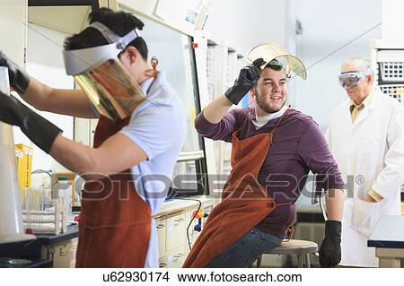 Picture - Engineering students in a chemistry laboratory. Fotosearch