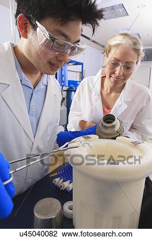 Stock Image - Engineering students in a laboratory. Fotosearch